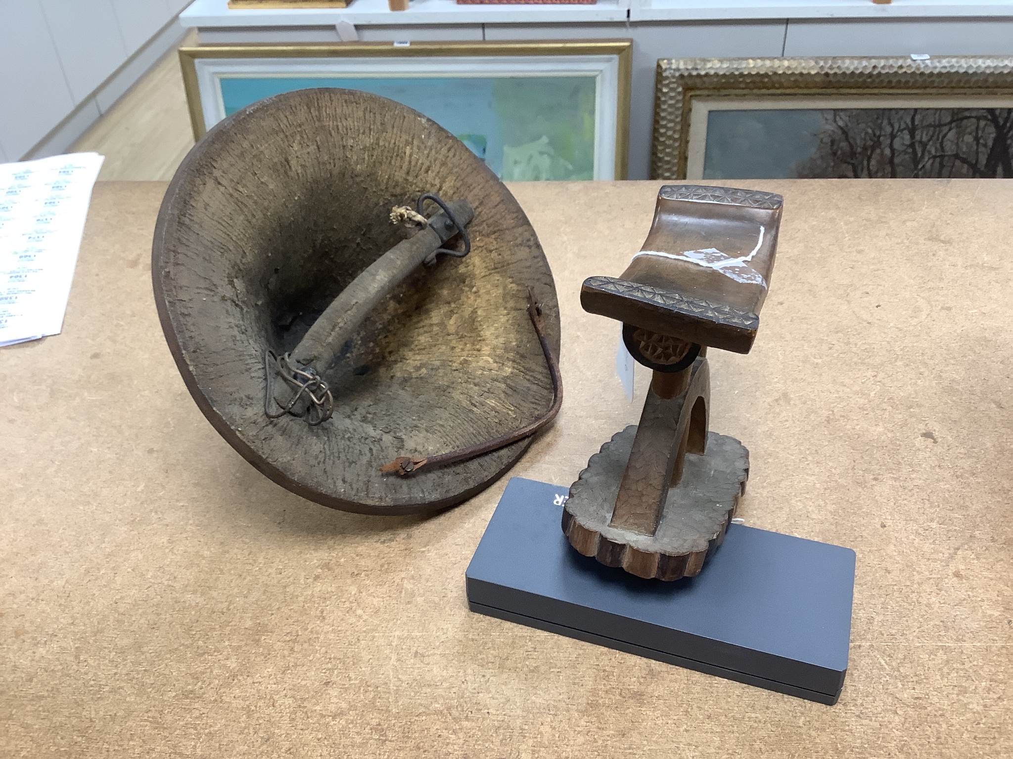 An Ashanti wood headrest and a small African wood shield